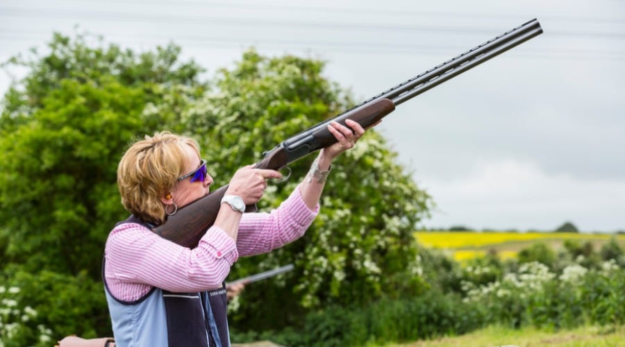 A female shooter with a shotgun