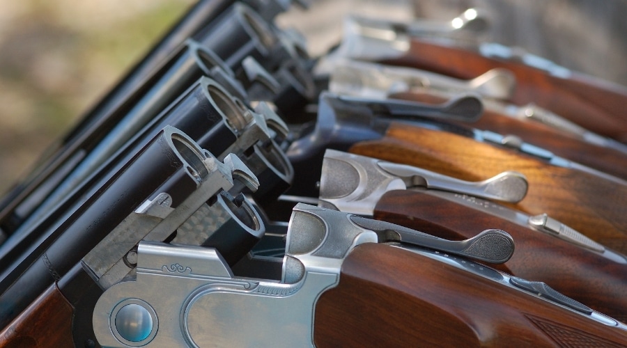 A close up of shotguns