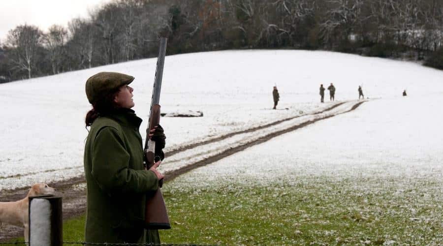 A shooter holding a shotgun