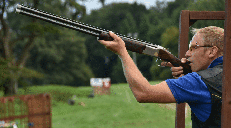 Shooter aiming a shotgun