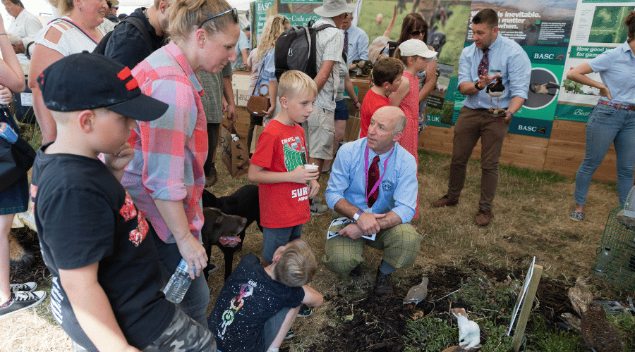 A group of children visiting the BASC stall