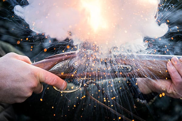 Close up of a shotgun ejecting sparks