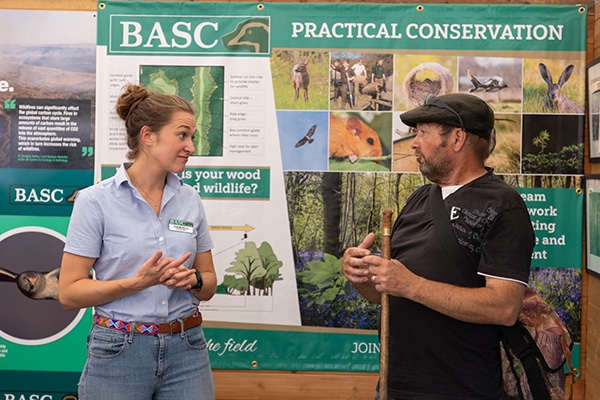 A BASC staff member talking to a member of the public