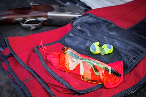 A pair of safety glasses and ear plugs on a safety vest - Image by Matt Kidd