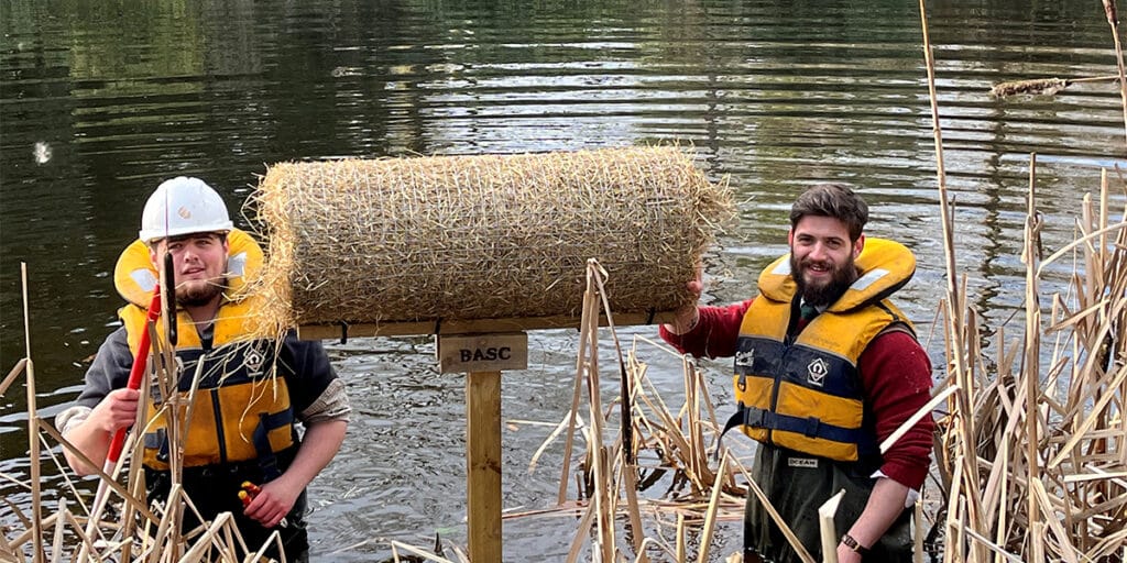 A duck nest tube installed over a pond