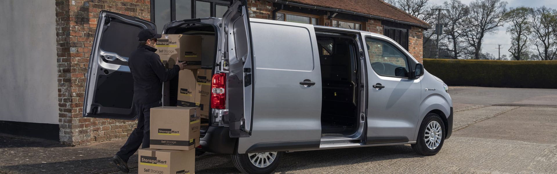 A man loading the back of a van