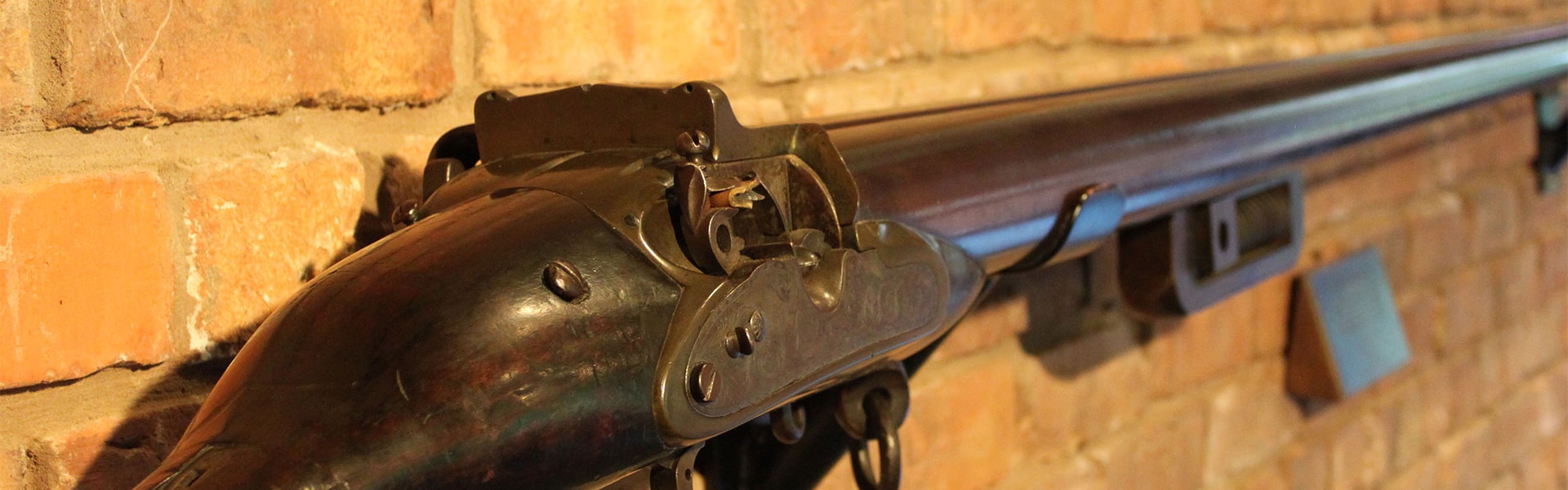An antique firearm hung on a wall