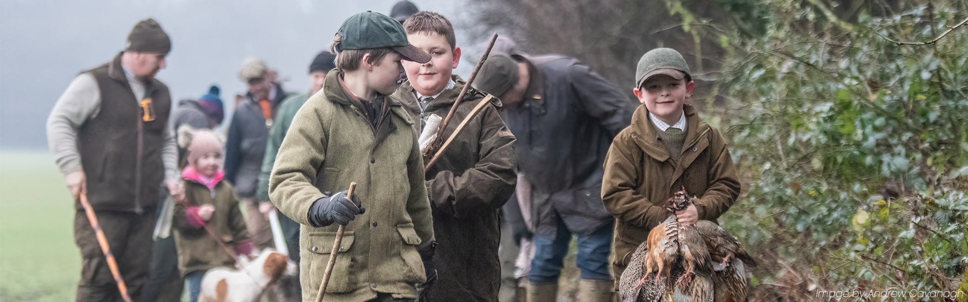 Young shooters walking together along a country land