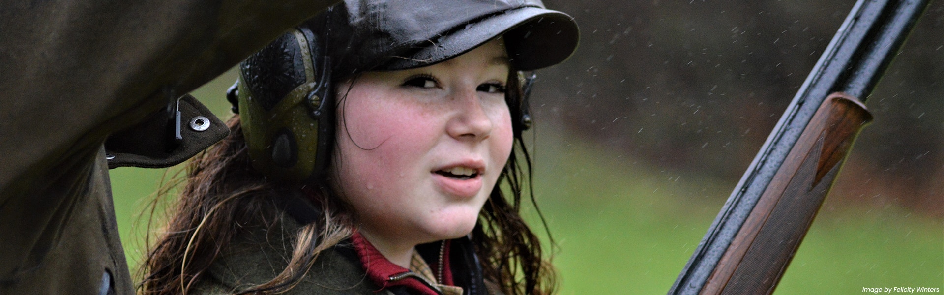 A young shot holding a shotgun