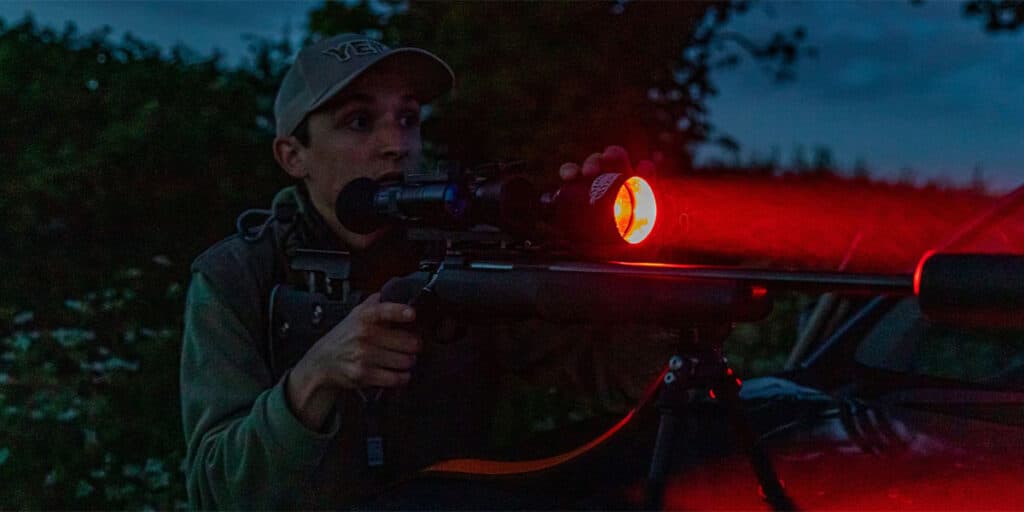 Night shooter with a rifle