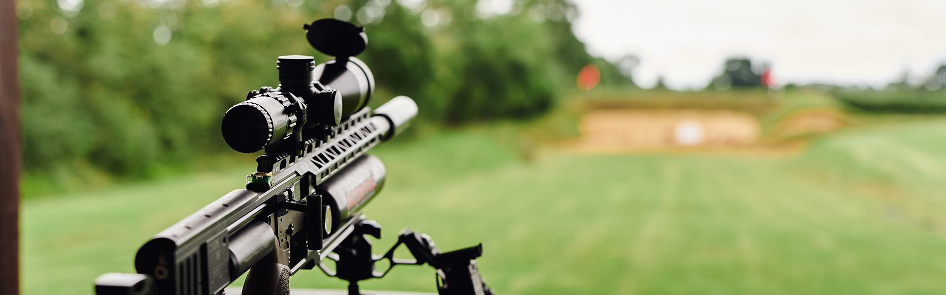 An air rifle aiming down a range