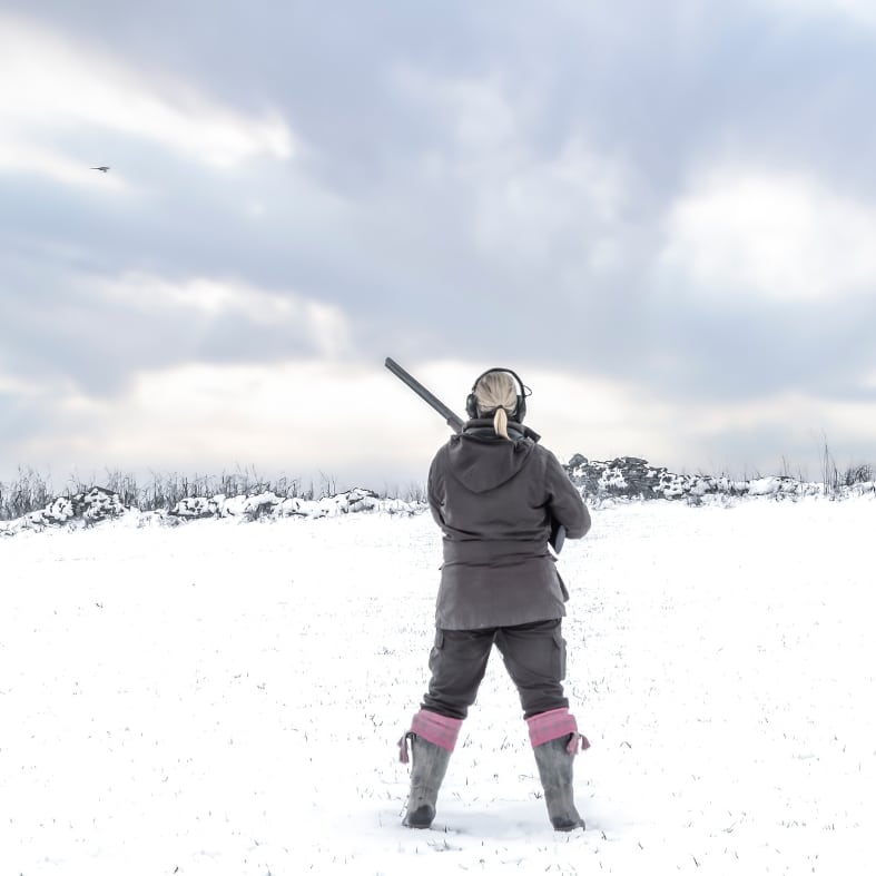 Woman shooting in snow