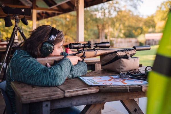 Woman shooting rifle