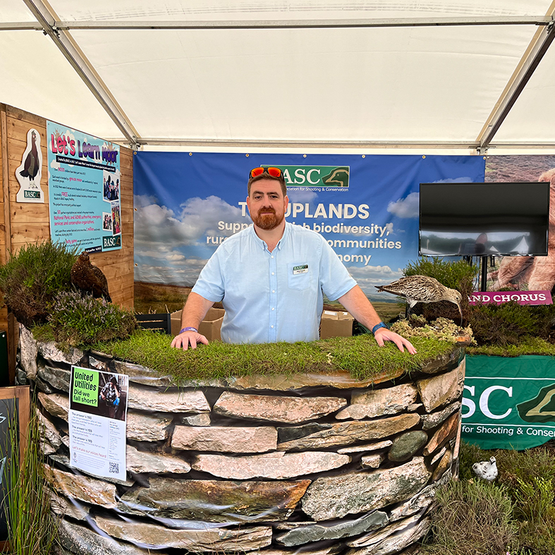 Alex Farrell at the Game Fair stand