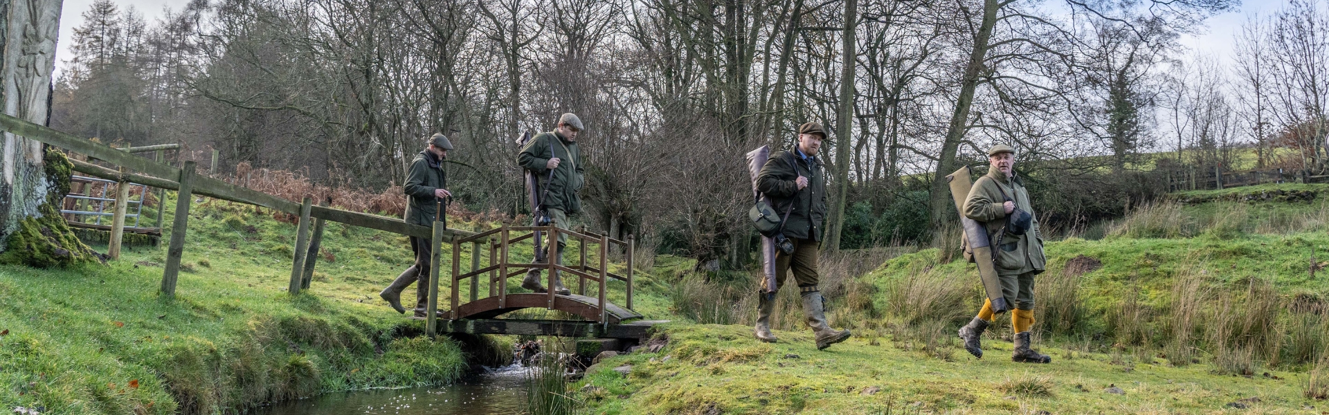 Guns walking over bridge