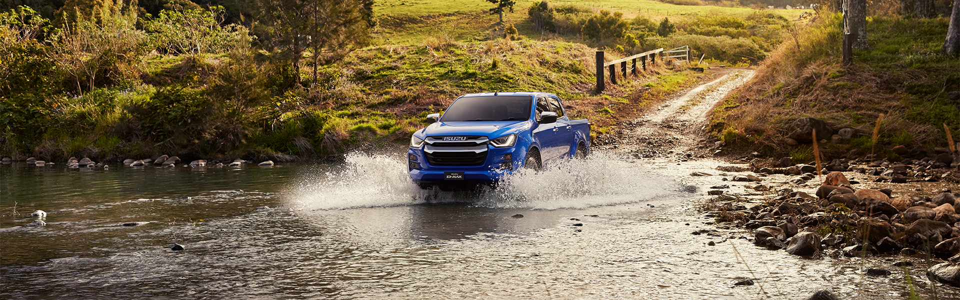 Isuzu 4x4 driving through water