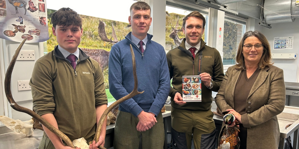 BASC Scotland Director Peter Clark with Tayside and Grampian Moorland Group coordinator Deirdre Falconer showing the students how to prepare the meat.