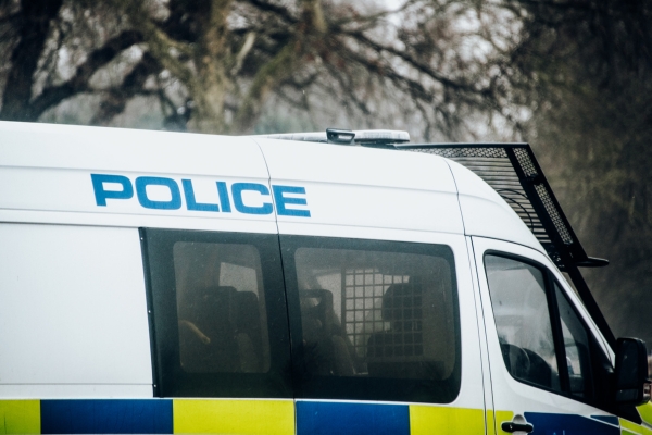 police van parked in a wood