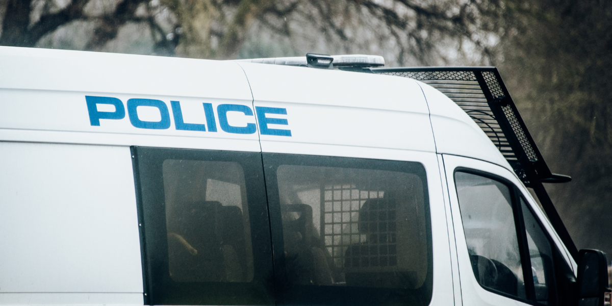 police van parked in a wood