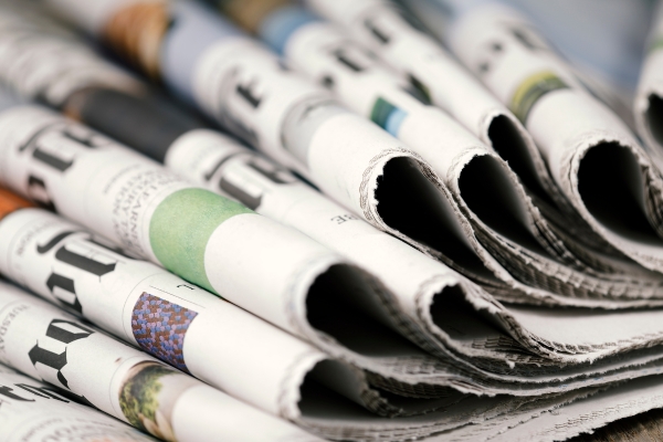 Pile of folded newspapers