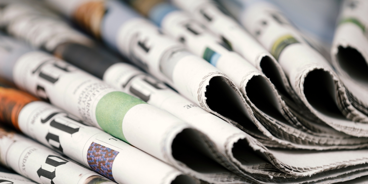 Pile of folded newspapers