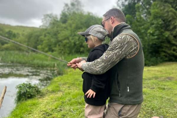 Curtis with daughter fishing