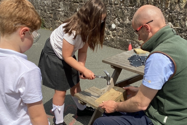 Children building bird boxes in Wales