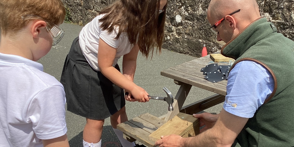 Children building bird boxes in Wales