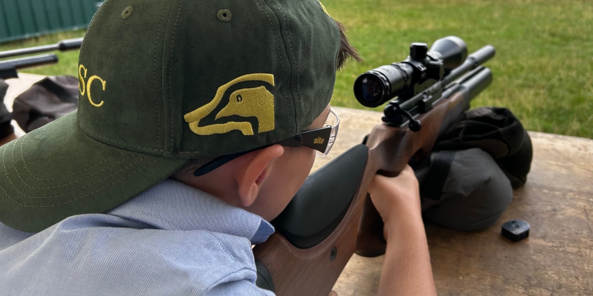 child shooting an airgun