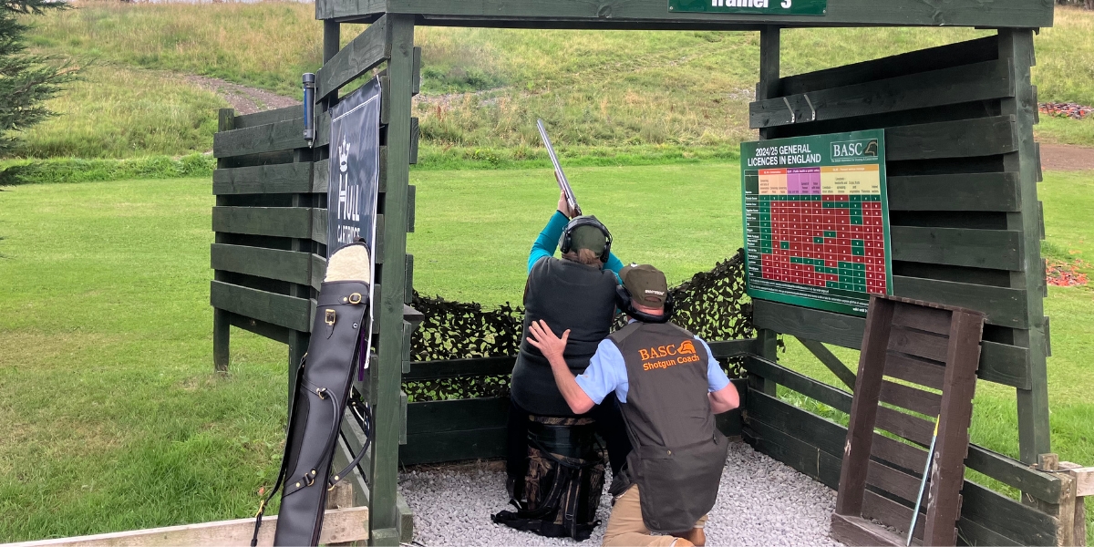 Seated gun clay pigeon shooting