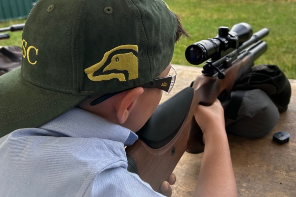 child shooting an airgun
