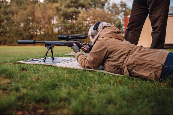 woman shooting rifle at Bisley